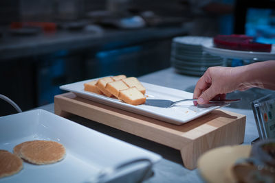 Midsection of person preparing food