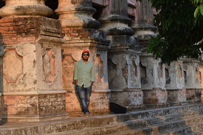 Man standing in front of a building