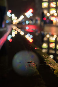 Defocused image of illuminated city at night