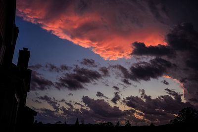 Low angle view of cloudy sky at sunset