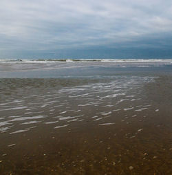 Scenic view of beach against sky