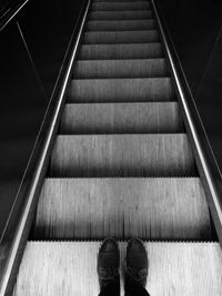 Close-up of man on escalator