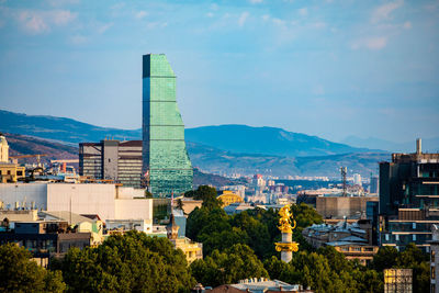 High angle view of buildings in city against sky