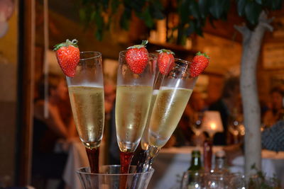 Champagne with strawberries in glass at restaurant