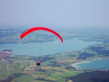 Hot air balloons flying over landscape