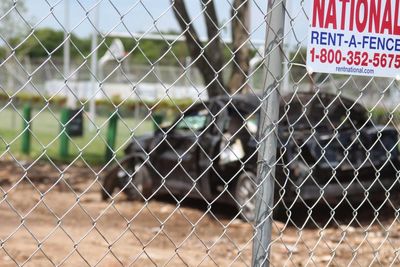 Text on chainlink fence