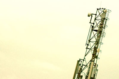 Low angle view of crane against clear sky
