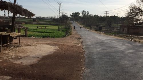 Surface level of empty country road along landscape