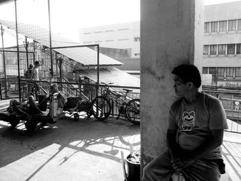 Man sitting in front of building