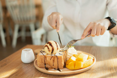 Midsection of man preparing food