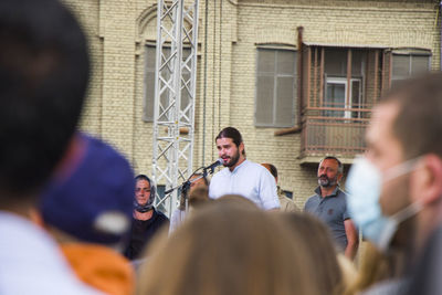 Group of people in front of building