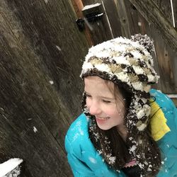 Cute girl in snow during winter