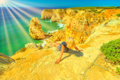 Woman sitting at beach