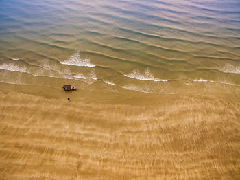 Aerial view of boat in sea during sunset