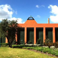 Buildings against cloudy sky