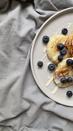 High angle view of food in plate pancakes with blueberrys