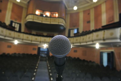 Close-up of microphone in theater