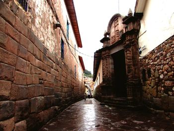 Narrow alley amidst buildings in city