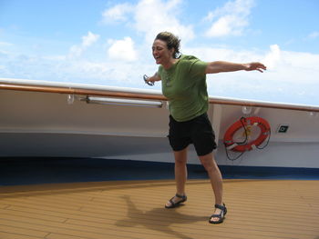 Full length of woman standing on shore