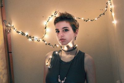 Portrait of woman standing at home