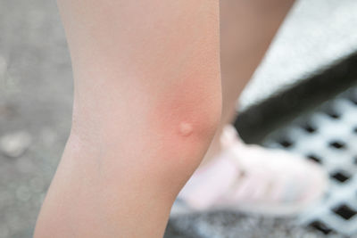 Low section of woman standing outdoors