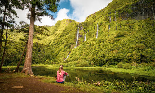 Amazing waterfalls, lake with reflection, water, green landscape, azores islands.