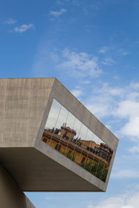 Low angle view of modern building against sky