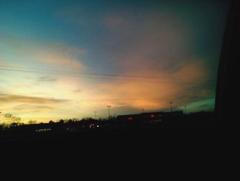 Silhouette of trees against sunset sky