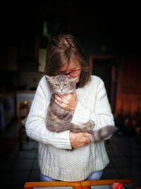 Woman holding cat