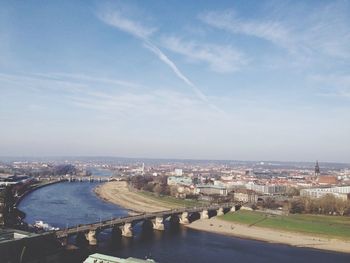 High angle view of bridge over river in city against sky