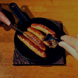 High angle view of man preparing food on table