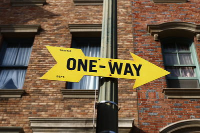 Low angle view of sign against building