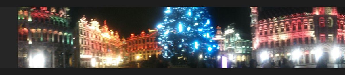 Illuminated buildings in city at night