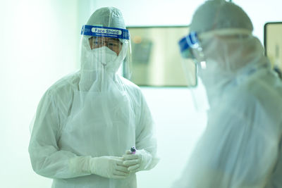 Midsection of man wearing mask