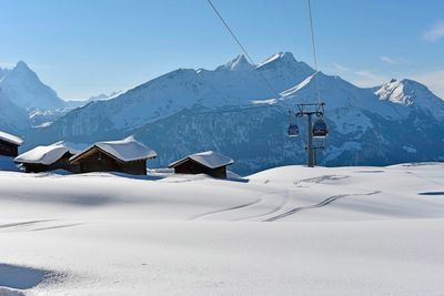 Scenic view of snowcapped mountains against sky