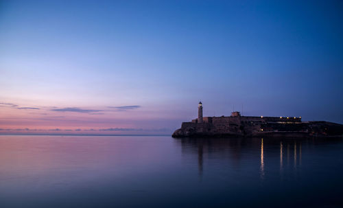 Scenic view of sea against blue sky