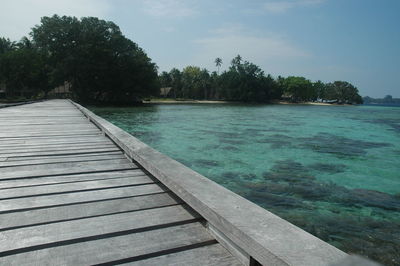 Pier over sea against sky