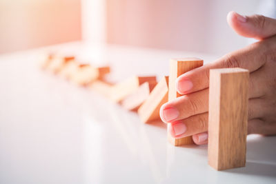 Close-up of hands holding table