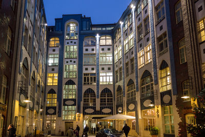 View of buildings in city at night