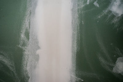 High angle view of surf on beach