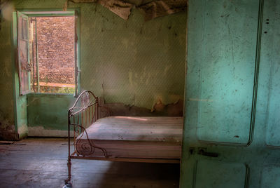 Empty chair in abandoned building