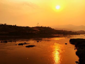Scenic view of sunset over river