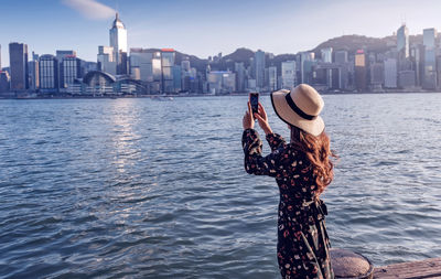 Asian woman traveler visiting in hong kong harbour, hong kong harbour 