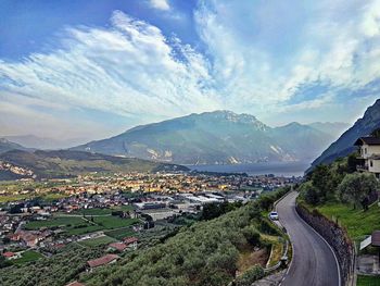 High angle view of road by lake against sky