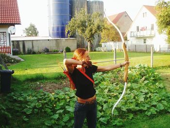 Woman standing on grass