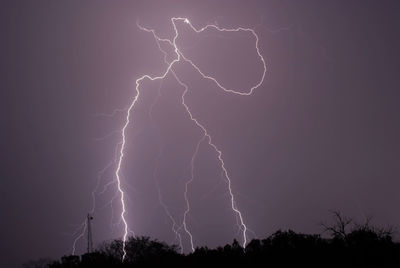 Low angle view of lightning against sky at night