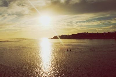 Scenic view of sea against sky at sunset