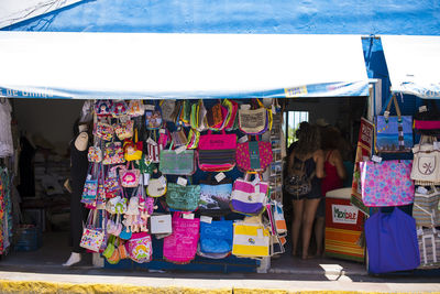 Clothes hanging in store for sale at market stall