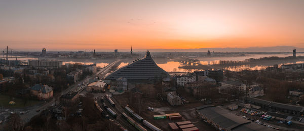 High angle view of illuminated buildings against sky during sunset