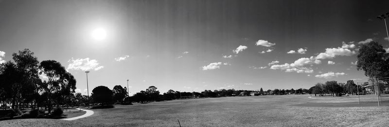 Panoramic view of trees in city against sky